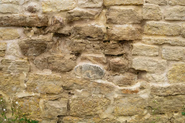 Muro de ladrillo rocoso. fondo de pared de piedra. textura grunge abstracta. vieja mampostería marrón —  Fotos de Stock