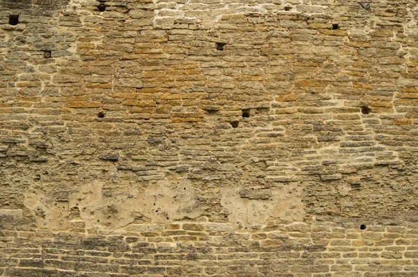 Parede de tijolo rochosa. fundo de parede de pedra. textura grunge abstrata. alvenaria marrom velho — Fotografia de Stock