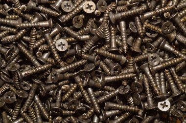 Arka planı vidalar. vidaları dokunarak yığın. bağlantı elemanları yığını