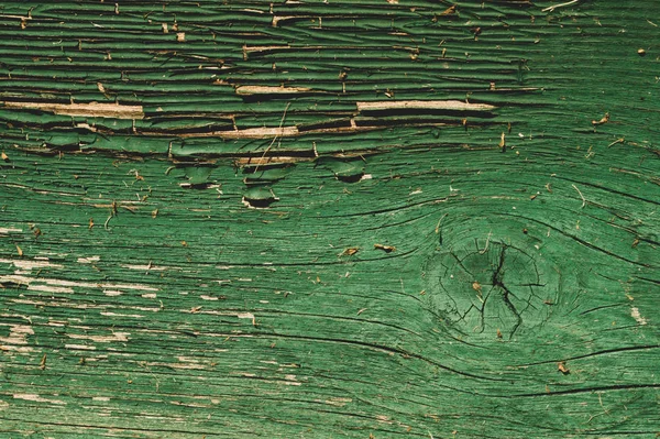 Abstrakcyjna tekstura drewna z łuszczącą się farbą. zielonym drewnianym tłem. shabby malowane drewno — Zdjęcie stockowe