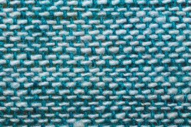 Kumaş makro doku. Örgü tekstil, yakın çekim. Örülmüş arka plan. Yünlü kumaş. Mavi ve beyaz iplikler
