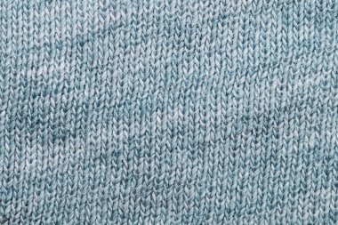 Kumaş dokusu. Yünlü tekstil. Örgü kumaşı yakın çekim. örülmüş arkaplan