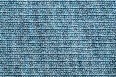 Kumaş dokusu. Yünlü tekstil. Örgü kumaşı yakın çekim. örülmüş arkaplan
