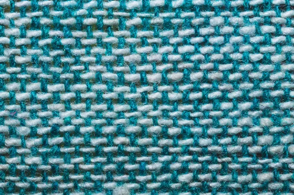 Kumaş makro doku. Örgü tekstil, yakın çekim. Örülmüş arka plan. Yünlü kumaş. Mavi ve beyaz iplikler