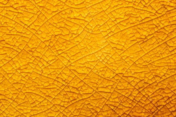 Kırık seramik doku yakın çekim. Kırık cam arka plan. Soyut sarı yüzey. kırık mozaik cam makro arkaplan