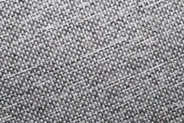Gri kumaş desenli makro. Tekstil arka planı son derece yakın. örgü deseni