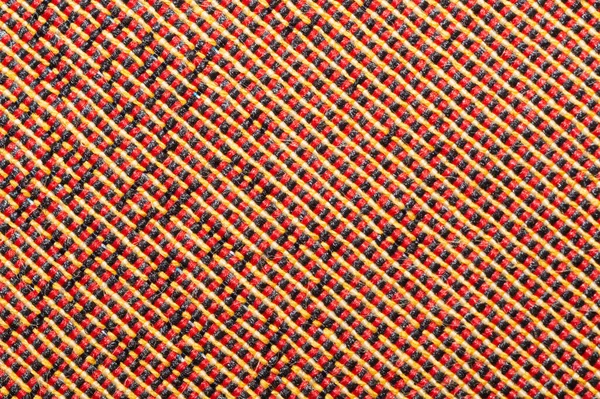 Fabric texture with red threads macro. textile background extremely close up. woven pattern