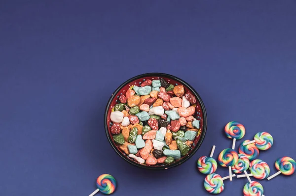 Lollipops and candies. candy bowl with sweets in the form of colored stones. copy space