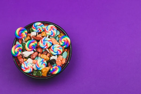 Lollipops and candies. candy bowl with sweets in the form of colored stones. copy space