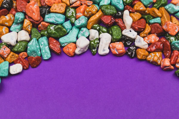 Candy pebbles. sweets in the form of colored stones. colorful candies background