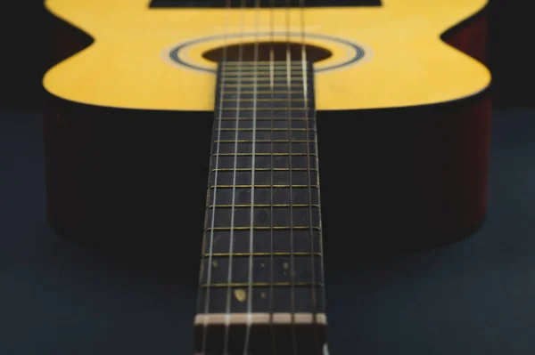 Acoustic guitar close up. musical instrument. strings on the guitar fretboard