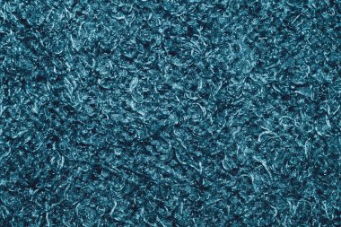 Yumuşak kumaş dokusu. Kıvırcık lifli turkuaz zarafet. Yün arkaplanı kapat