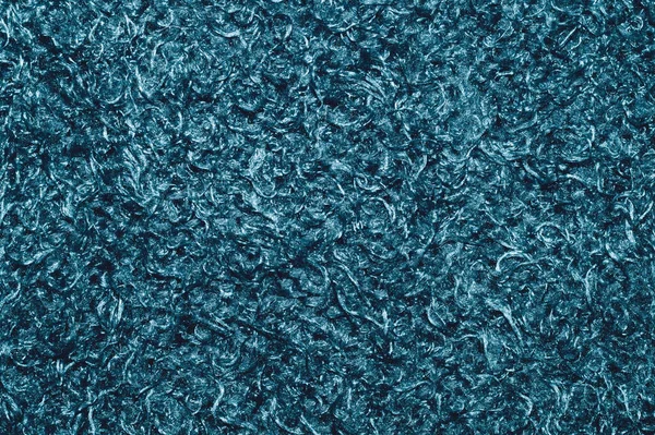 Soft fabric texture. turquoise extile with curly fibers. wool background close up
