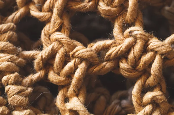 Hasır iplik makrosu. Örgü örüyorum. soyut örülmüş arkaplan