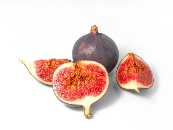 Fresh ripe whole and sliced figs on a white background. — Stock Photo, Image