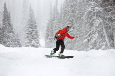 Snowboarder female offpiste forest ski slope clipart