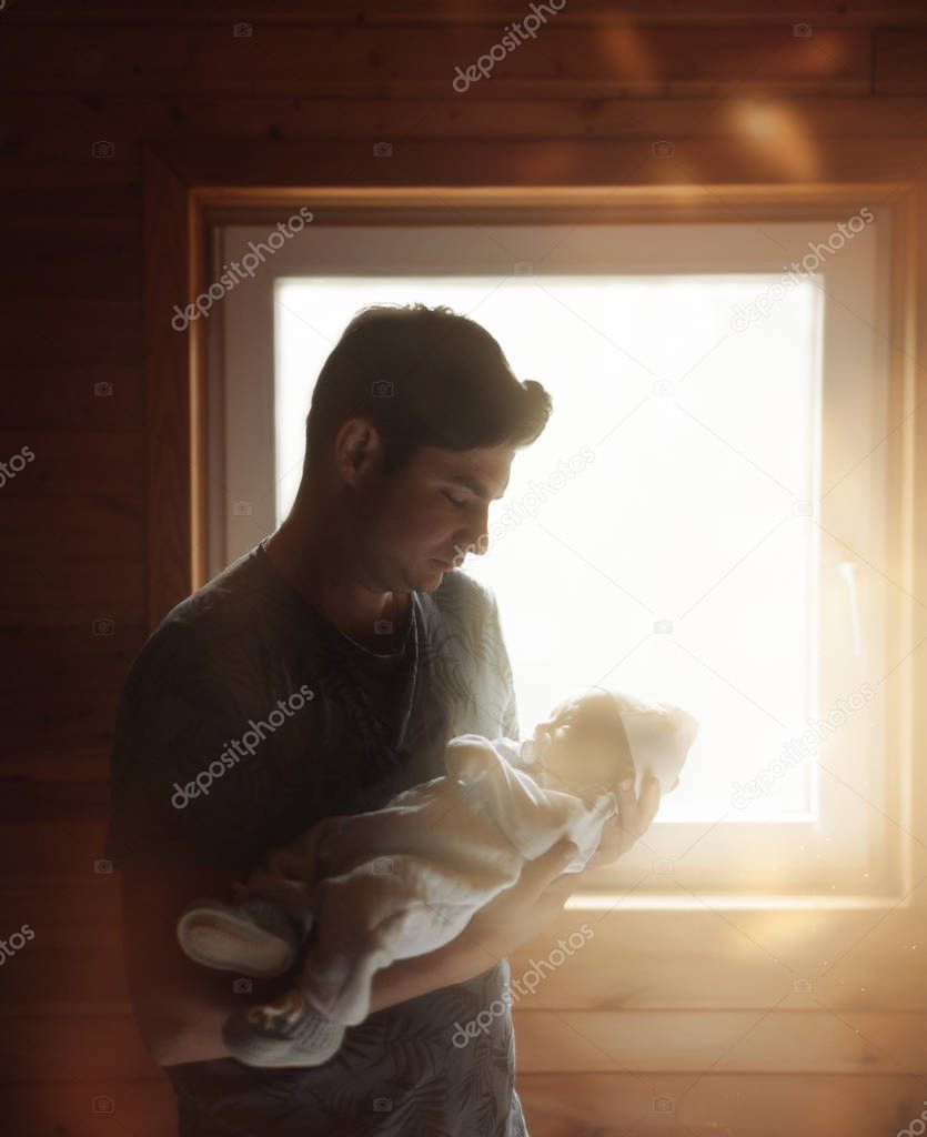 Father with a baby in his hands