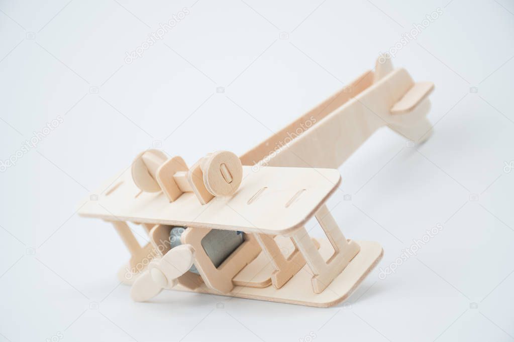 Wooden model plane in accident concept.