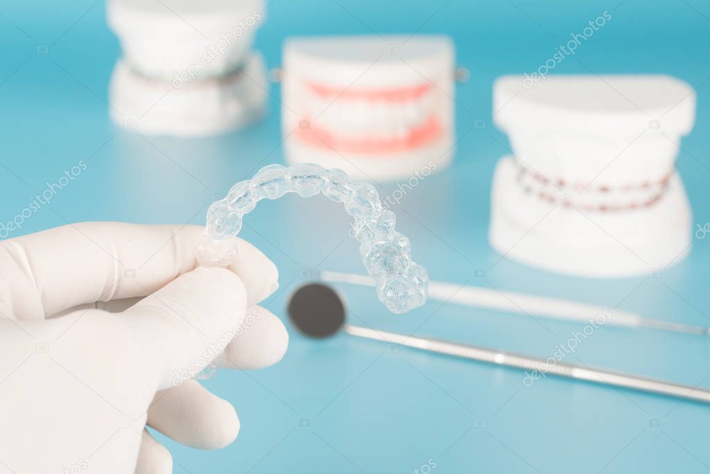 Clear orthodontic with model in dental care concept.