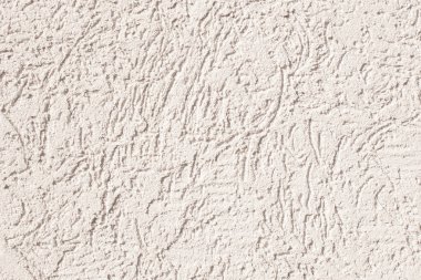 Beton duvar sürtünme ile evin fotoğrafı. Güneşli bir gün. Doku arka plan