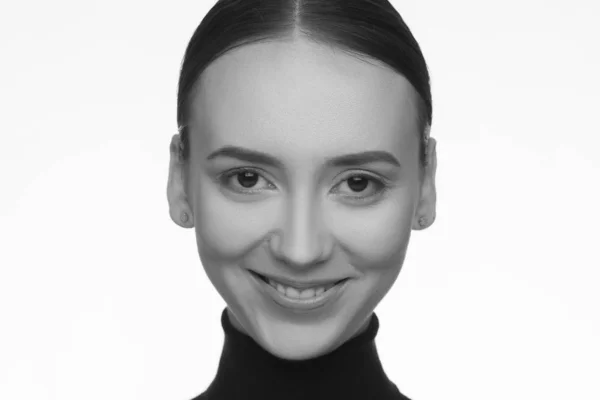 Portrait of a woman with an interesting appearance in a black turtleneck and with collected hair — Stock Photo, Image