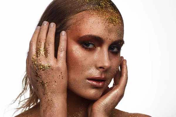 Portrait of a beautiful woman with expressive creative make-up in bronze. Studio beauty photo session — Stock Photo, Image