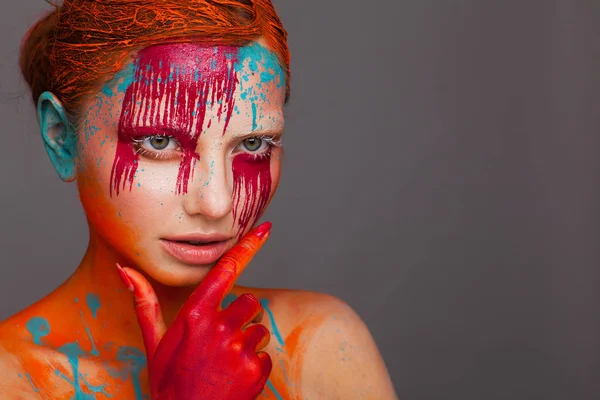Portrait of a model in an expressive creative style using an unusual make-up — Stock Photo, Image