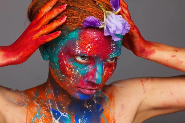 Creative fantastic makeup using colorful paints on the model — Stock Photo, Image