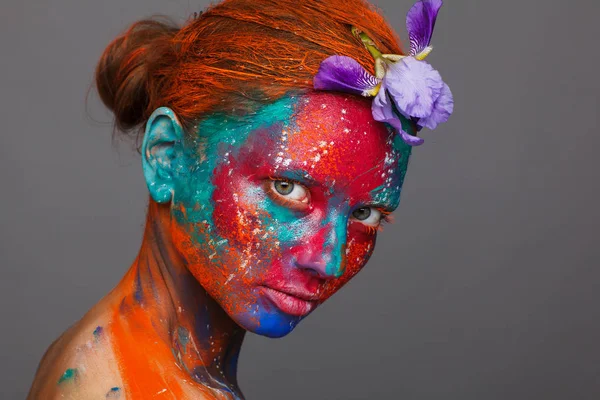 Creative fantastic makeup using colorful paints on the model — Stock Photo, Image