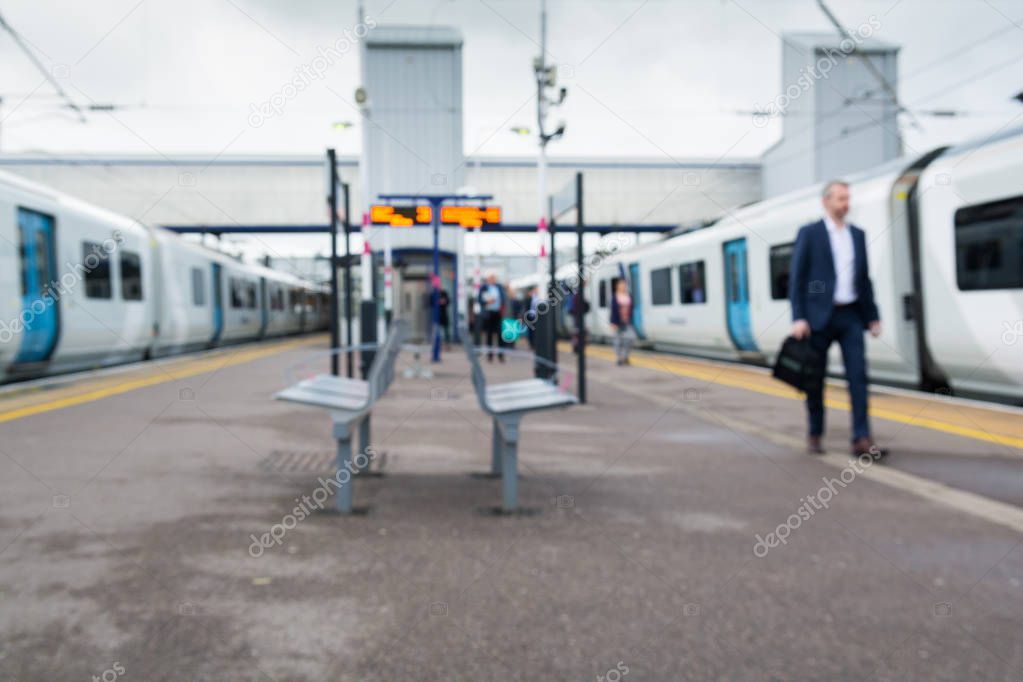 People on the railway platform boarding a train