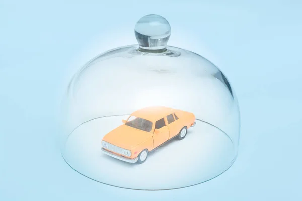 Car and automobile insurance, model car is protected by glass dome
