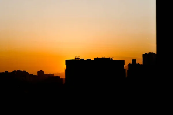 Urban city with tall buildings and sunset — Stock Photo, Image