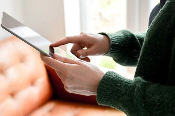 Young trendy woman using tablet device at home with fashionable — Stock Photo, Image