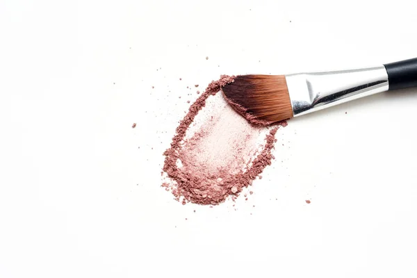 Make up brush with brush stroke of colored make up powder — Stock Photo, Image