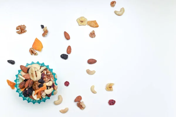 Healthy snack food trail mix of mixed nuts and dried fruits