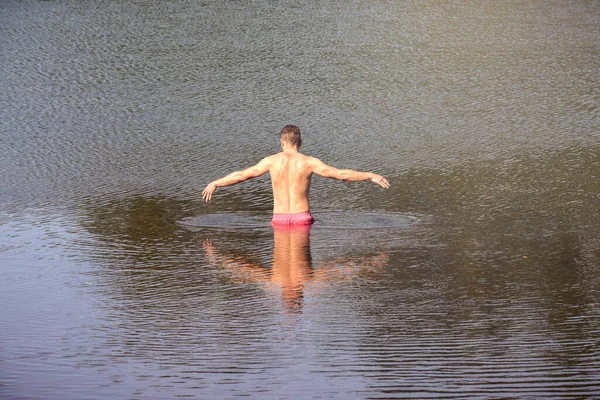 Man Walks Out Lake Swim Reflections Calm Water Stock Photo