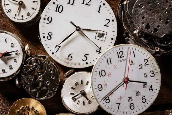 Old watch Faces making a background — Stock Photo, Image