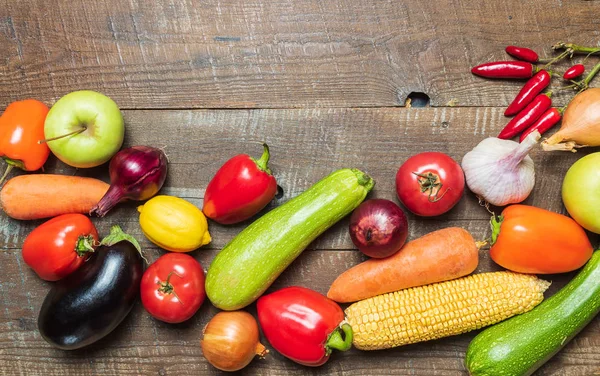 Food concept. Flat lay of different vegetables on old wooden table with copy space.