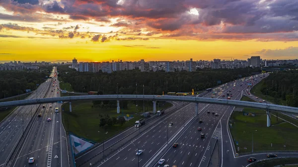 View from the air on the movement of cars on the overpasses at t