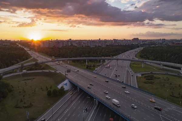 View from the air on the movement of cars on the overpasses at t