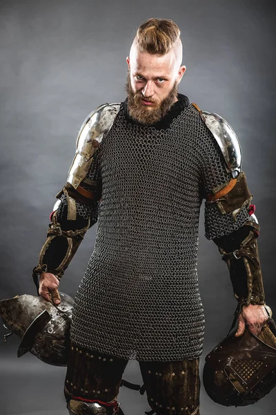 Medieval warrior berserk Viking with axes attacks enemy. Concept historical photo — Stock Photo, Image