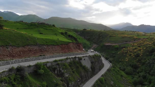 The sun sits behind a high-rise hills from a birds eye view. 4K — Stock Video