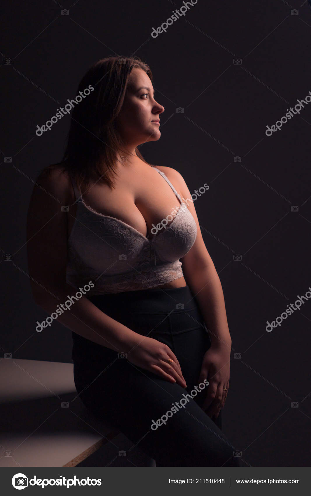 Plus size sexy model in white bra, fat woman with big natural breast on  gray studio background, overweight female body, long hair Stock Photo by  ©2735369.mail.ru 211510448