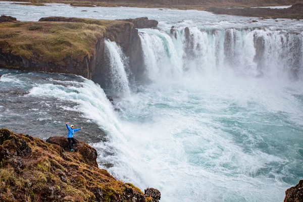 Icelandic waterfall in Icelandic natural landscape. Famous sights and attractions in Icelandic natural landscape on Southern Iceland