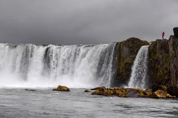 Icelandic waterfall in Icelandic natural landscape. Famous sights and attractions in Icelandic natural landscape on Southern Iceland
