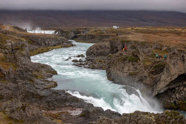 Icelandic waterfall in Icelandic natural landscape. Famous sights and attractions in Icelandic natural landscape on Southern Iceland