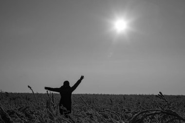 The girl rejoices in the sun and winter. Winter landscape. Sunny frosty day