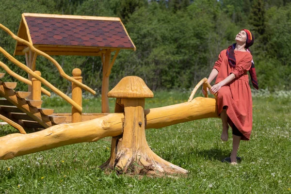 Girl National Dress Sways Swing — Stock Photo, Image