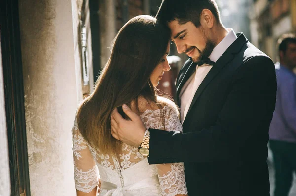 Beautiful married  couple on the street of Venice hugging