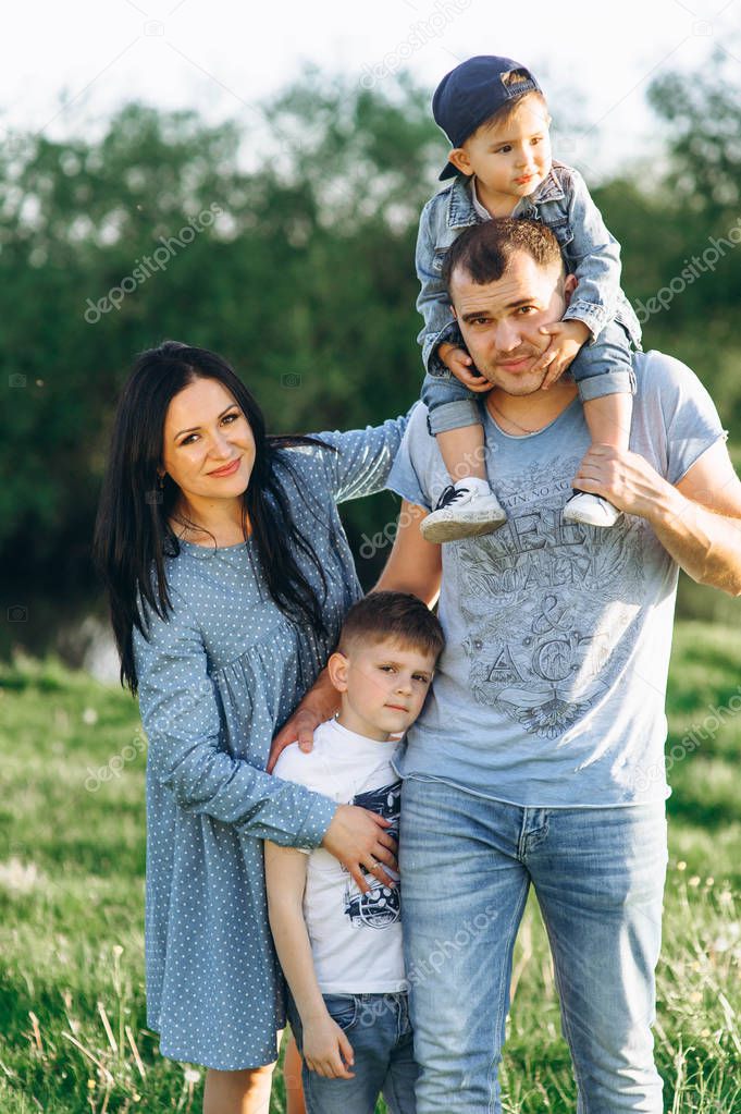 happy family with two children outdoors 